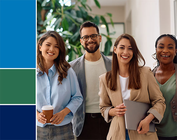 Group of four people smiling at camera