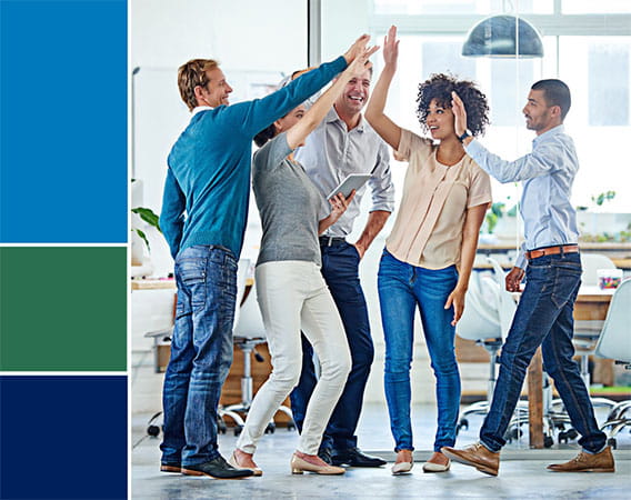 group of 5 people standing and doing a high five with everyone in the group