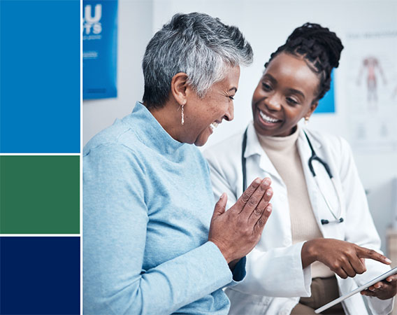 Doctor talking with patient, both are smiling