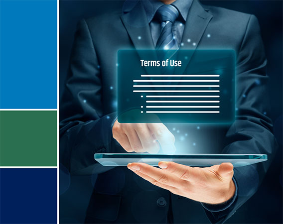 Man holding a laptop - in front of him an image projected that reads terms of use