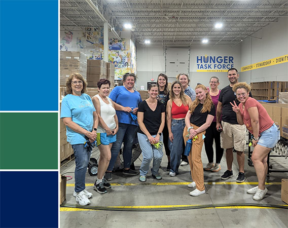 Group of NIS employees at Hunger Task Force facility